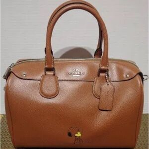 Snoopy and coach together